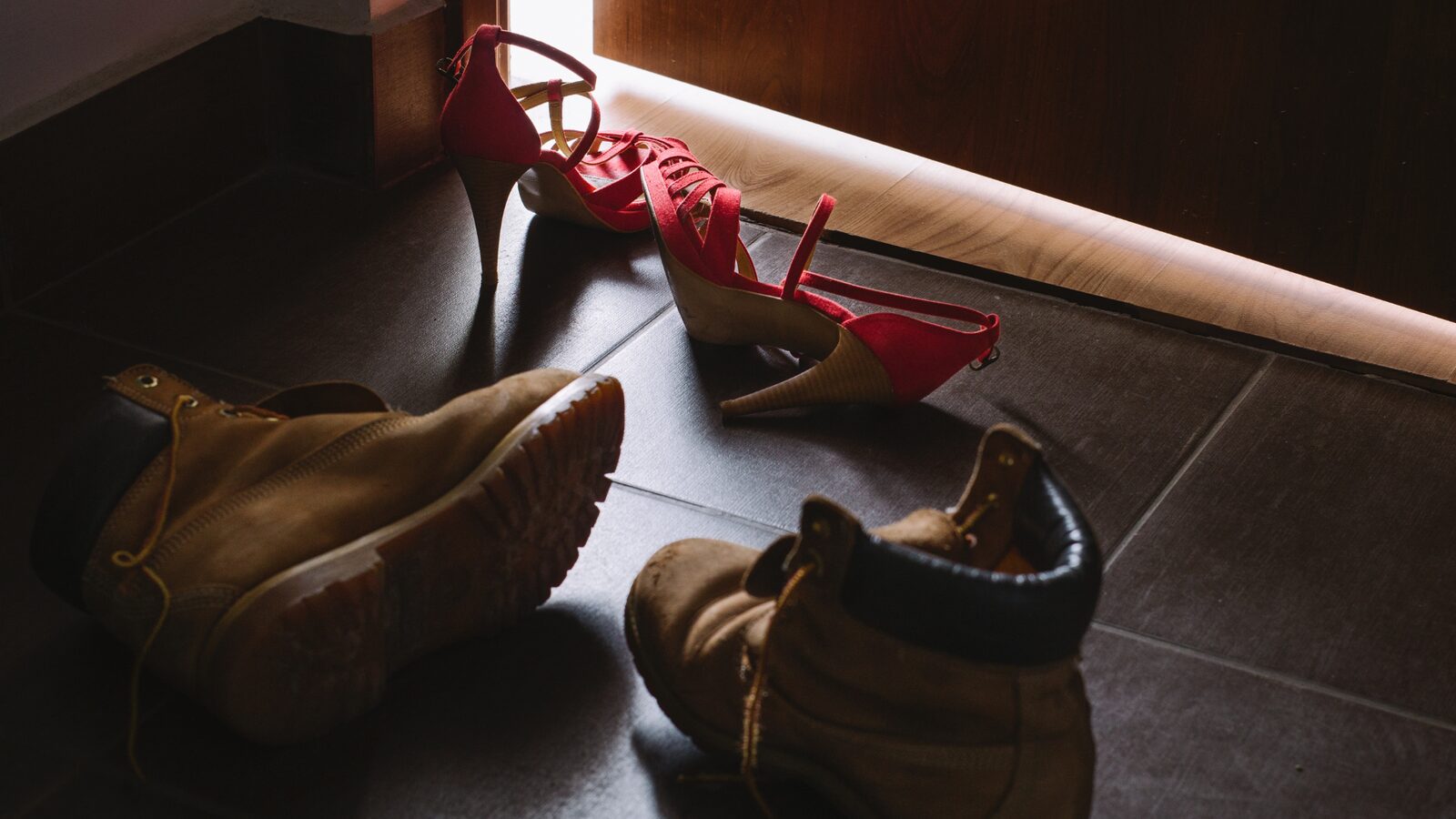 Discarded shoes on a bedroom floor